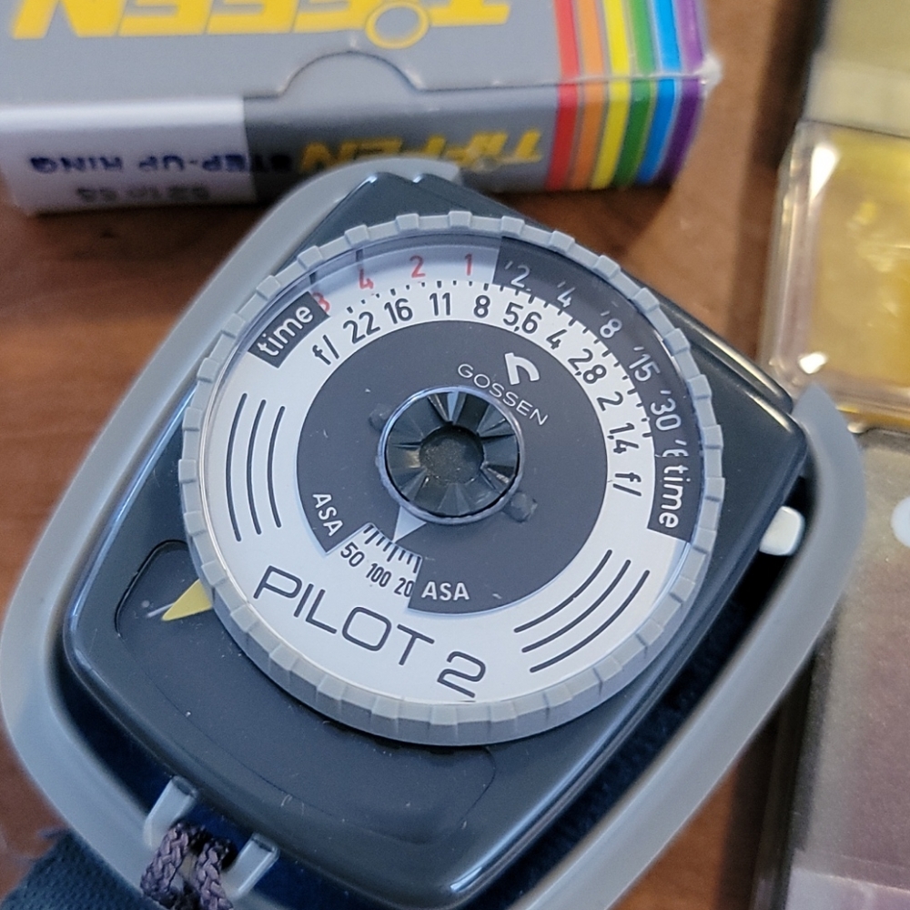 Vintage Camera Filters and Pilot light meter for photography effects.